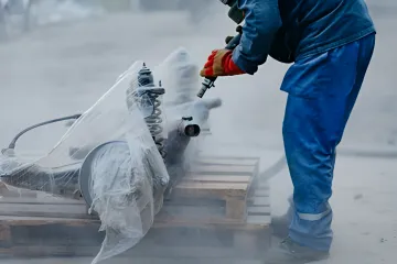 Professional shot blasting equipment preparing metal surfaces on-site