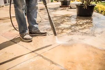 Professional wet abrasive blasting equipment in operation on industrial metal surface