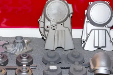 Industrial powder coating process showing metal parts in large production oven