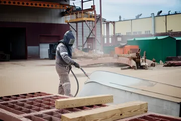 Eco-friendly dustless blasting process showing clean metal surface with no environmental contamination