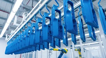 Industrial coating process showing surface preparation and powder coating application