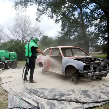 Vehicle undercarriage showing rust-free metal surface after professional blasting treatment
