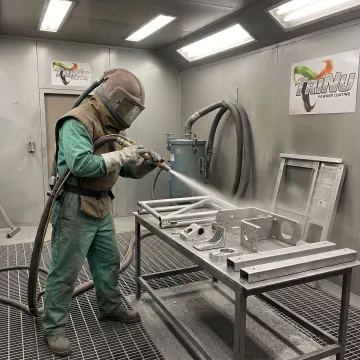 Shot blasting aerospace metal components