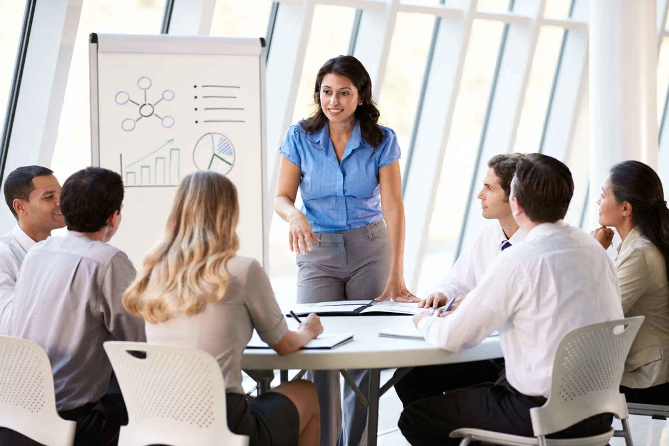 Corporate training session with facilitator leading leadership development workshop