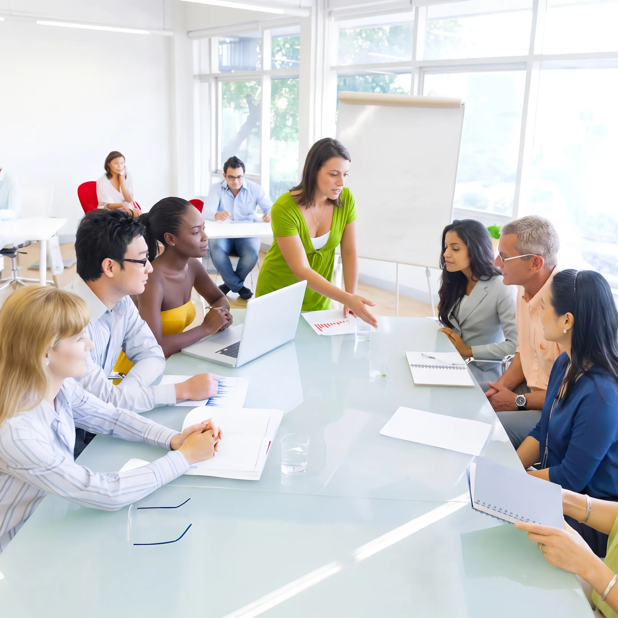 Supervisor facilitating an interactive leadership training session with a diverse team in a conference room
