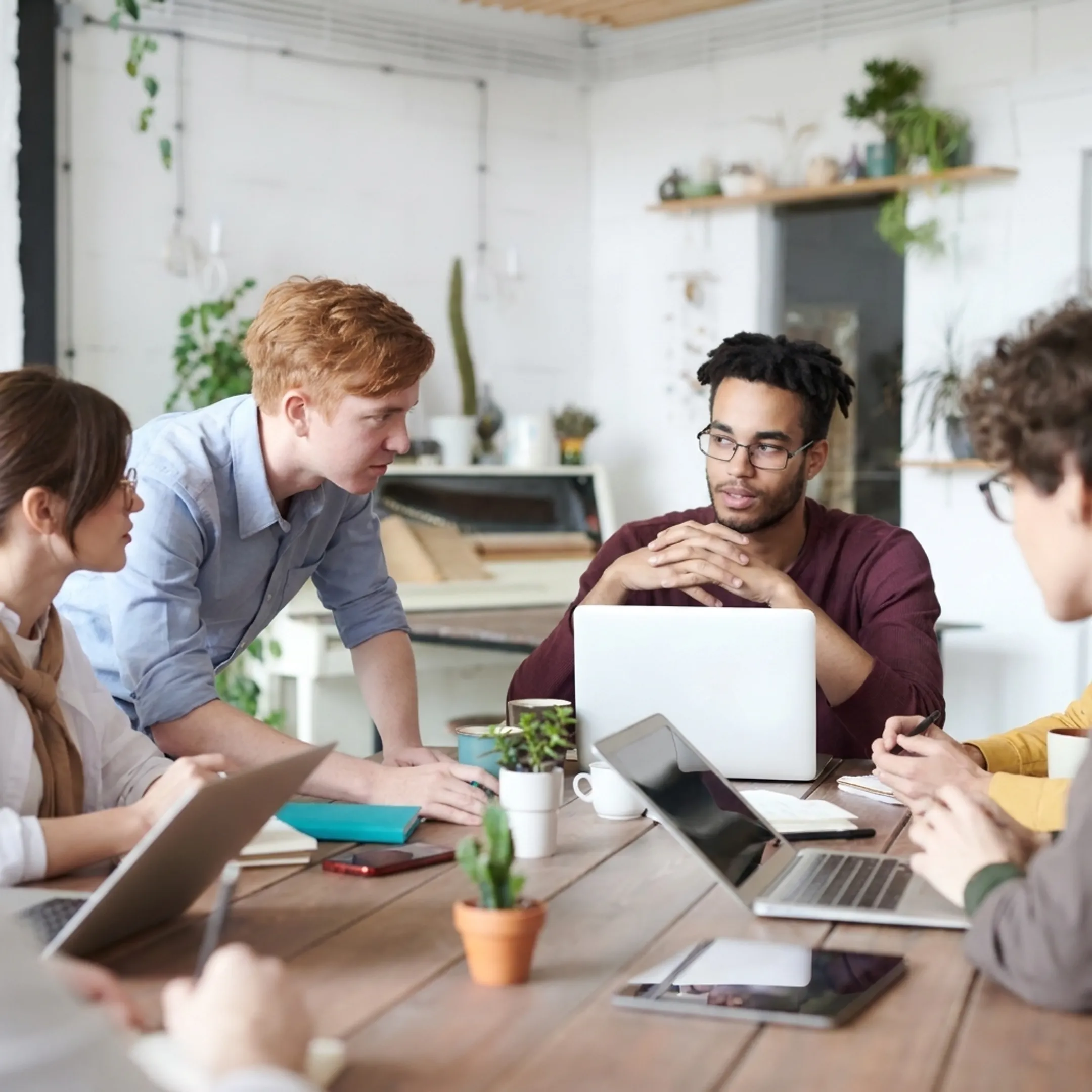 Nonprofit team participating in a collaborative workshop around a conference table