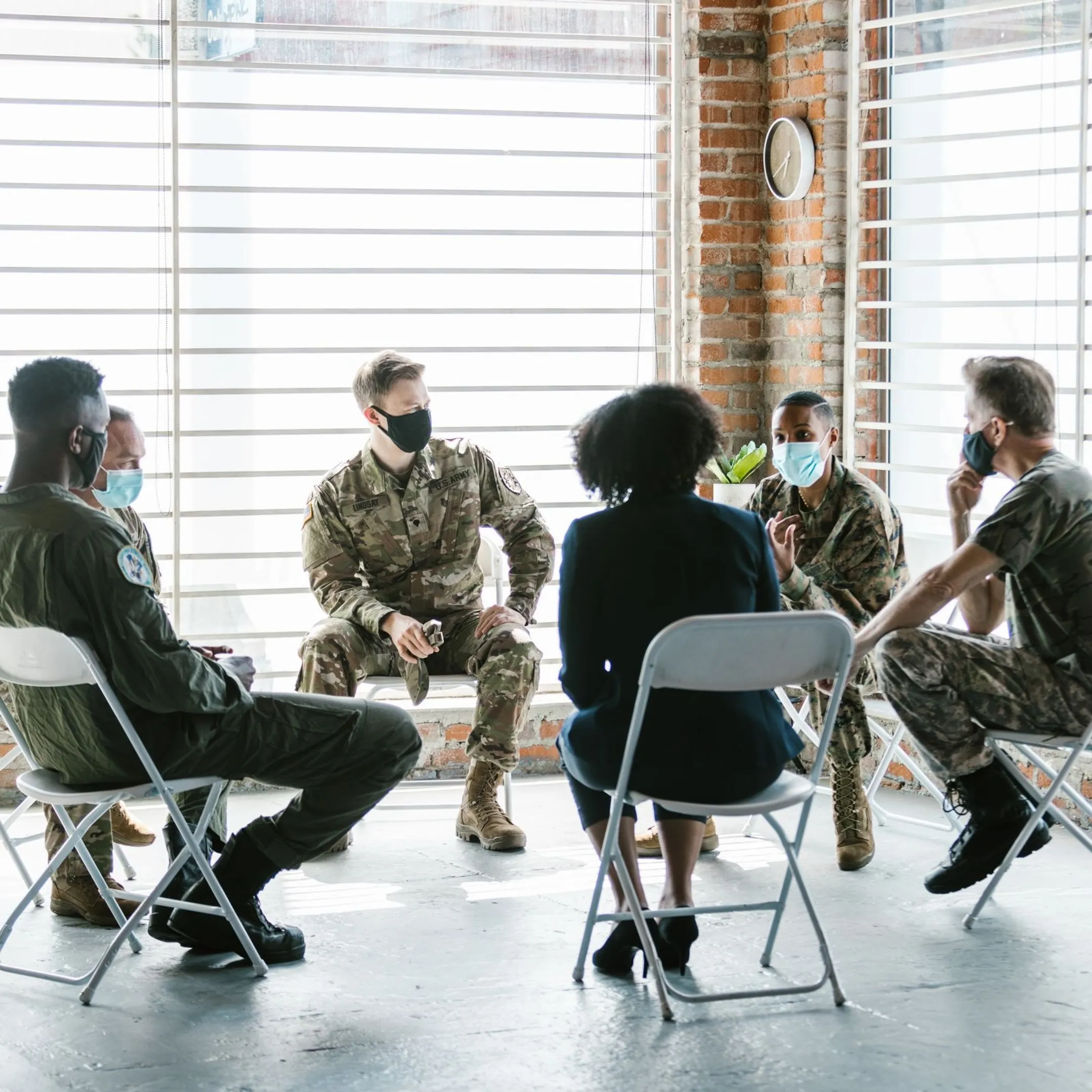 Military personnel participating in a professional team communication workshop