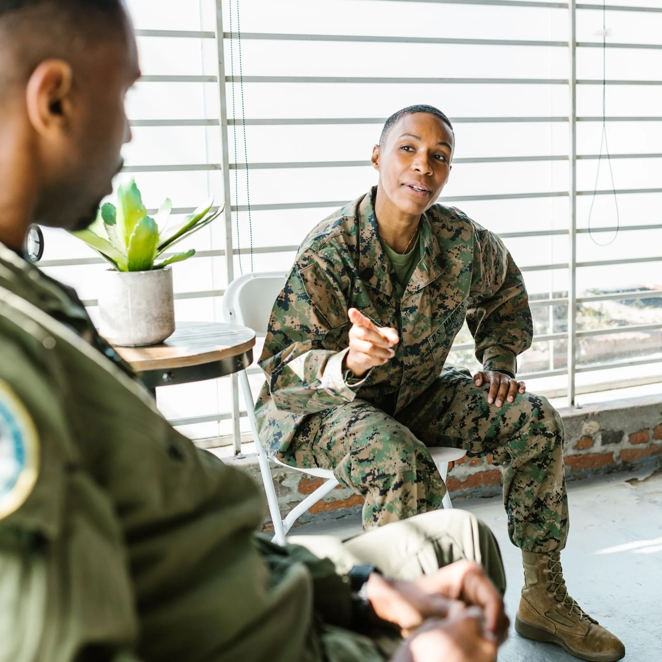 Military team members collaborating effectively during a professional conflict resolution training workshop