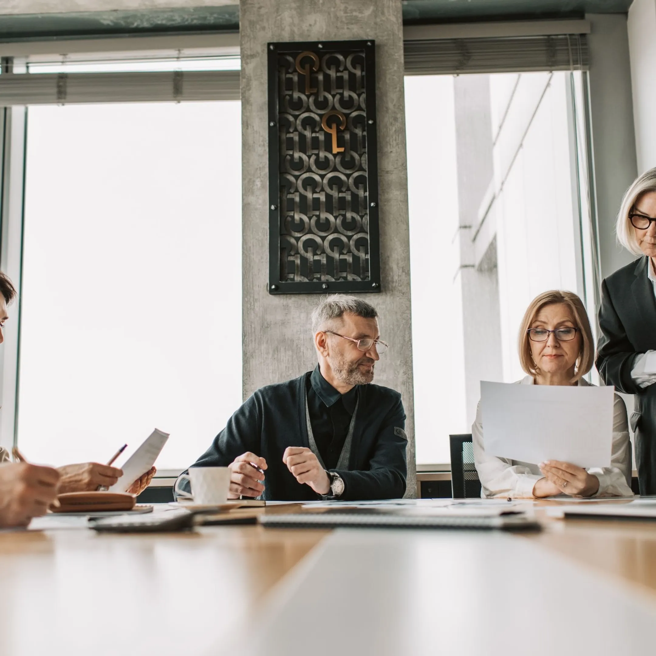 C-suite executives collaborating in an executive leadership development session
