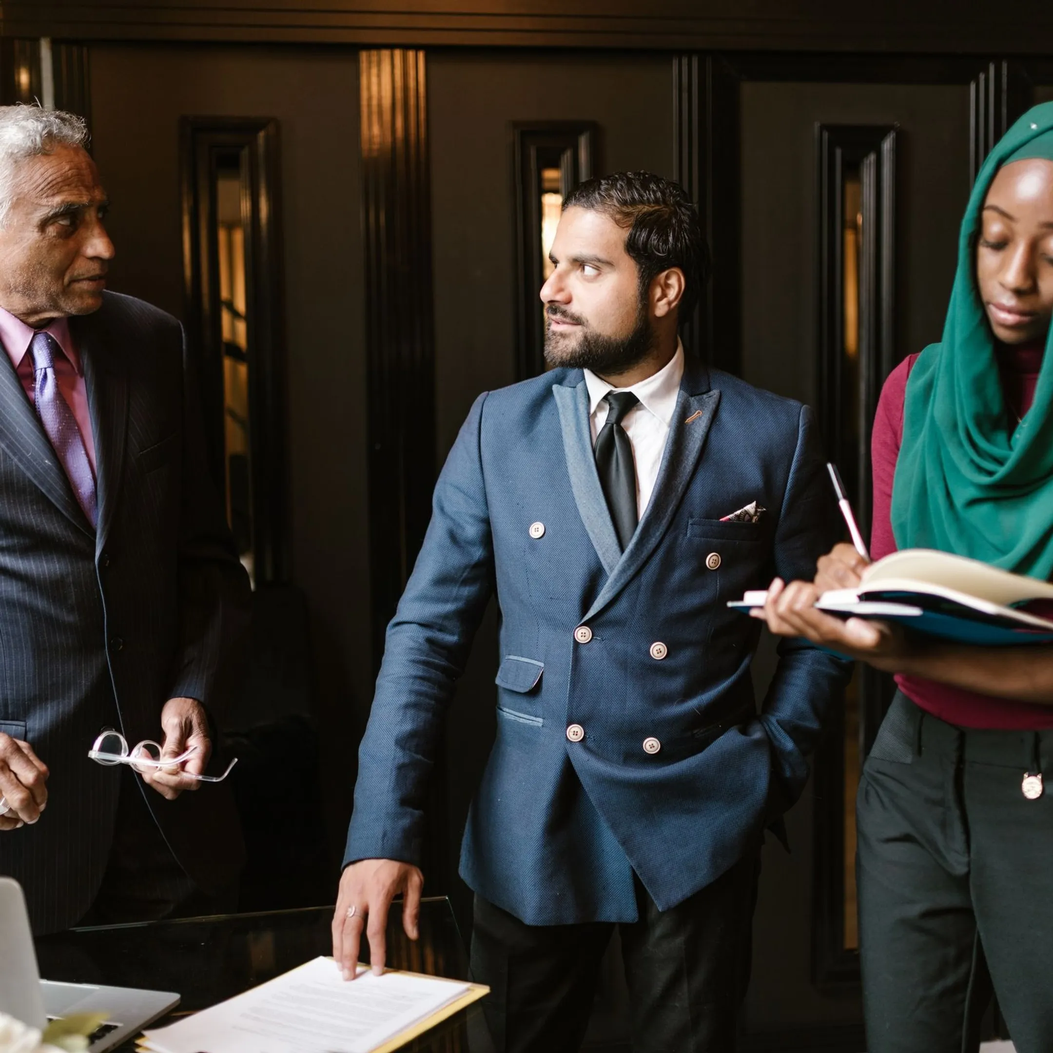 Diverse global team collaborating during a cultural workplace training workshop