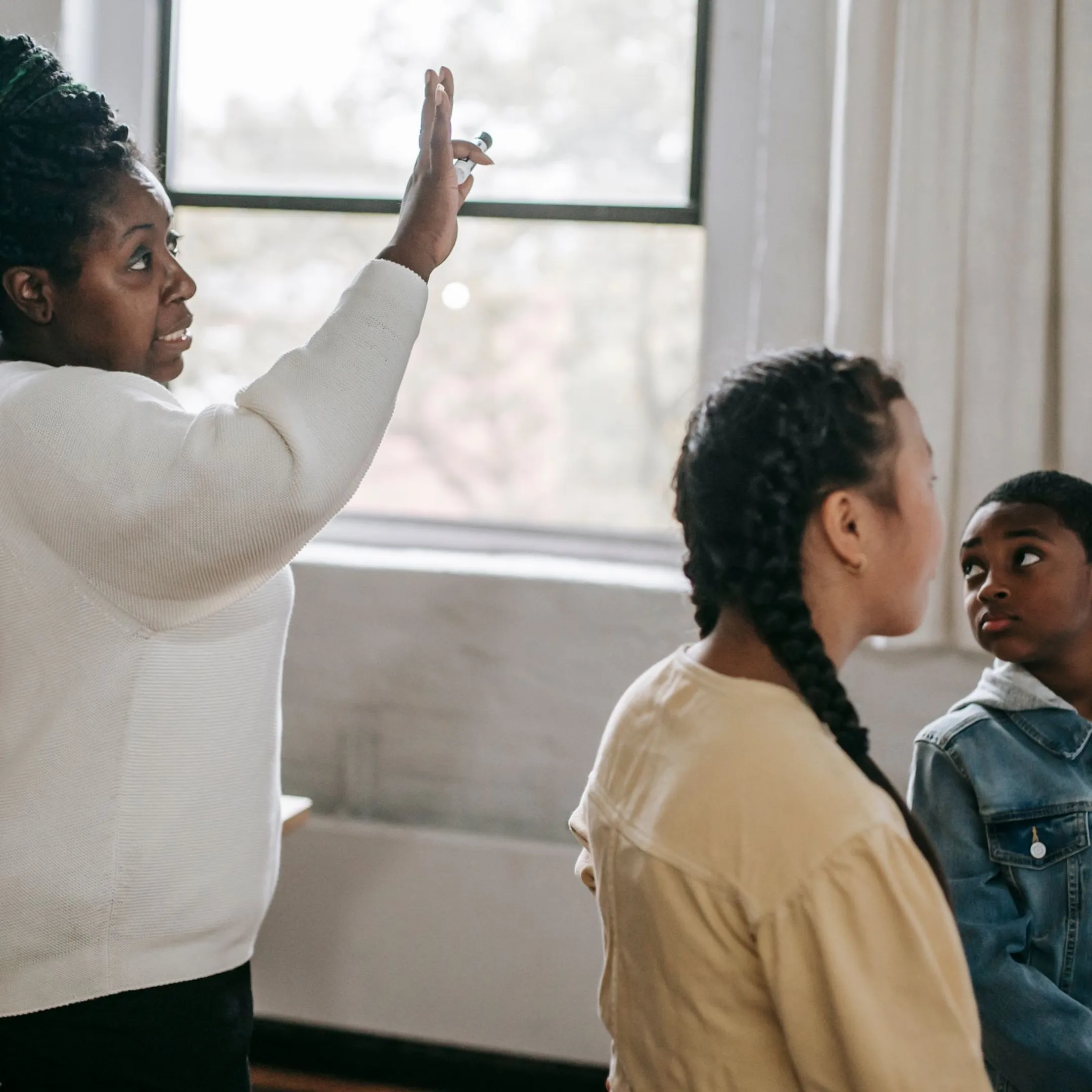 Teacher leading an engaged classroom discussion