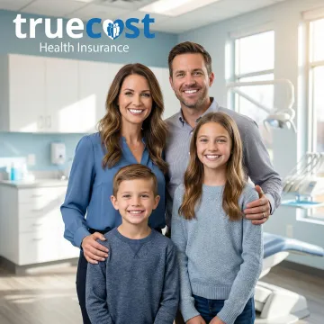 Family smiling with healthy teeth after using dental insurance coverage in Indiana