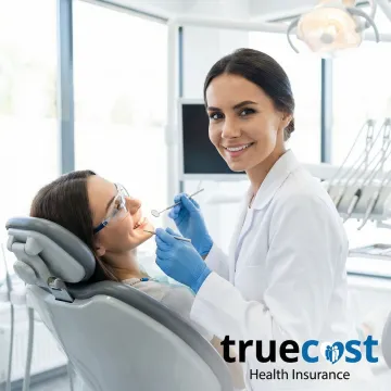 Dentist examining Montana patient's teeth with modern equipment