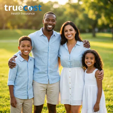 Happy family smiling showing healthy teeth after receiving affordable dental care