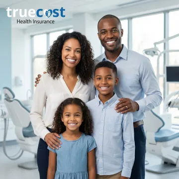 Family smiling with healthy teeth after dental checkup