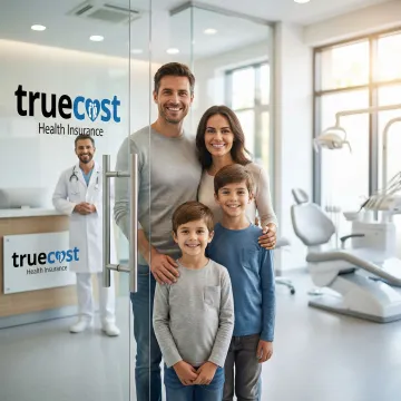 Family smiling after dental checkup in Wilmington clinic