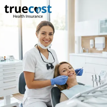 Dentist examining patient's teeth during routine checkup