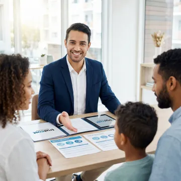Family reviewing dental insurance benefits guide with advisor
