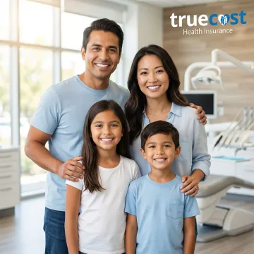 Family smiling confidently with healthy teeth after obtaining comprehensive dental insurance coverage