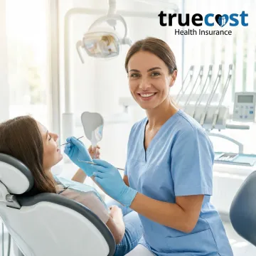 Dentist examining patient with modern dental equipment