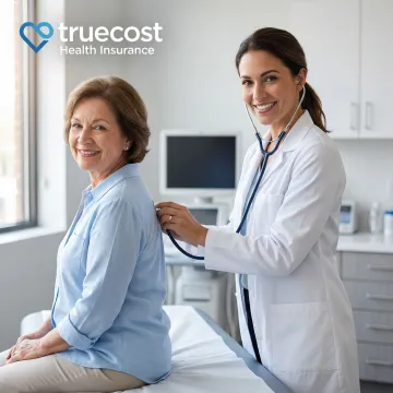 Doctor conducting preventive health screening with patient in modern medical office