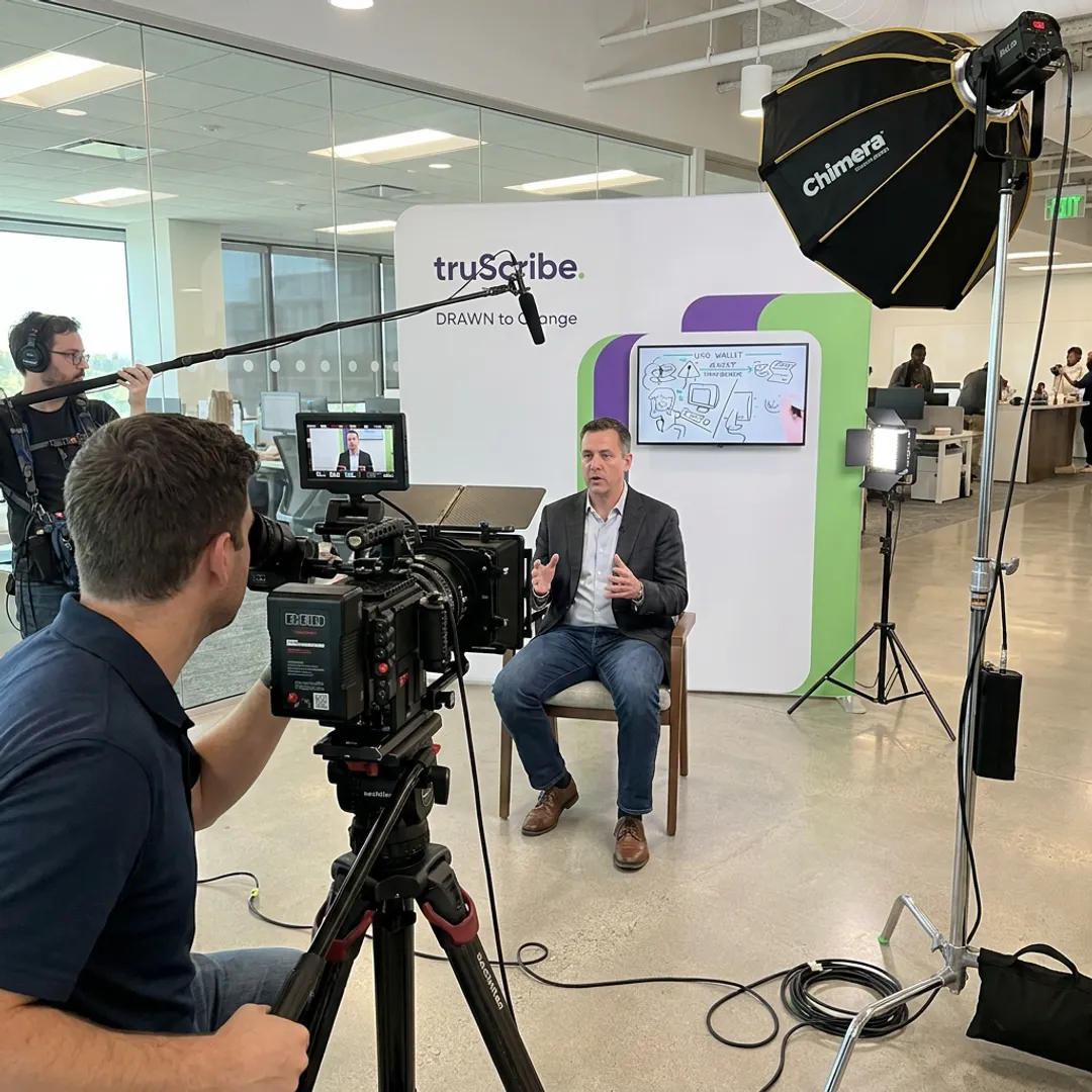 Corporate video crew filming an executive interview