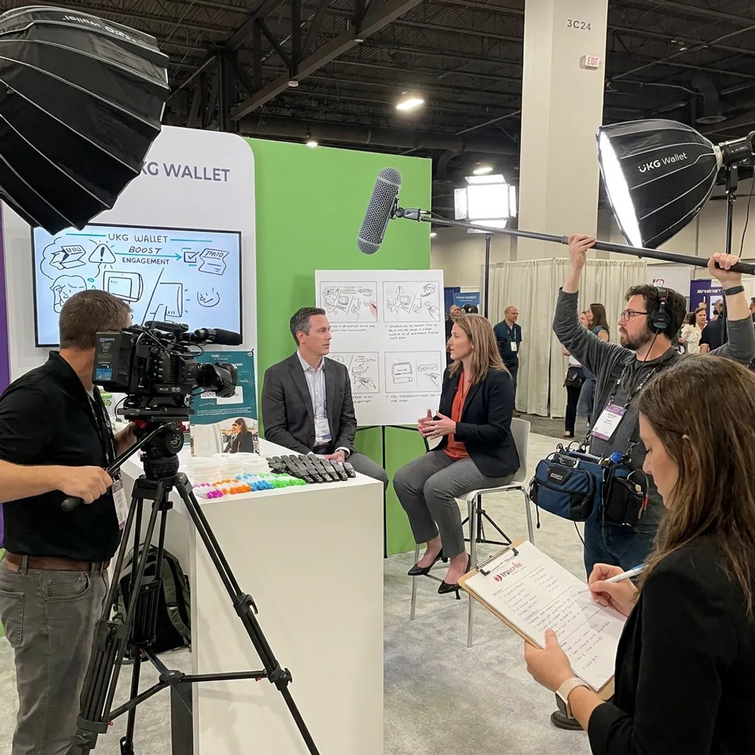 Business video production crew filming an interview
