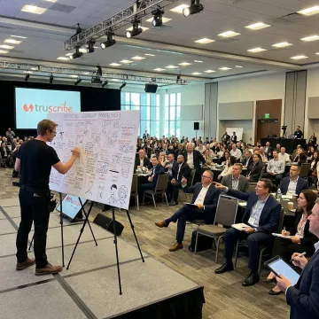 Live illustrator drawing at a corporate conference