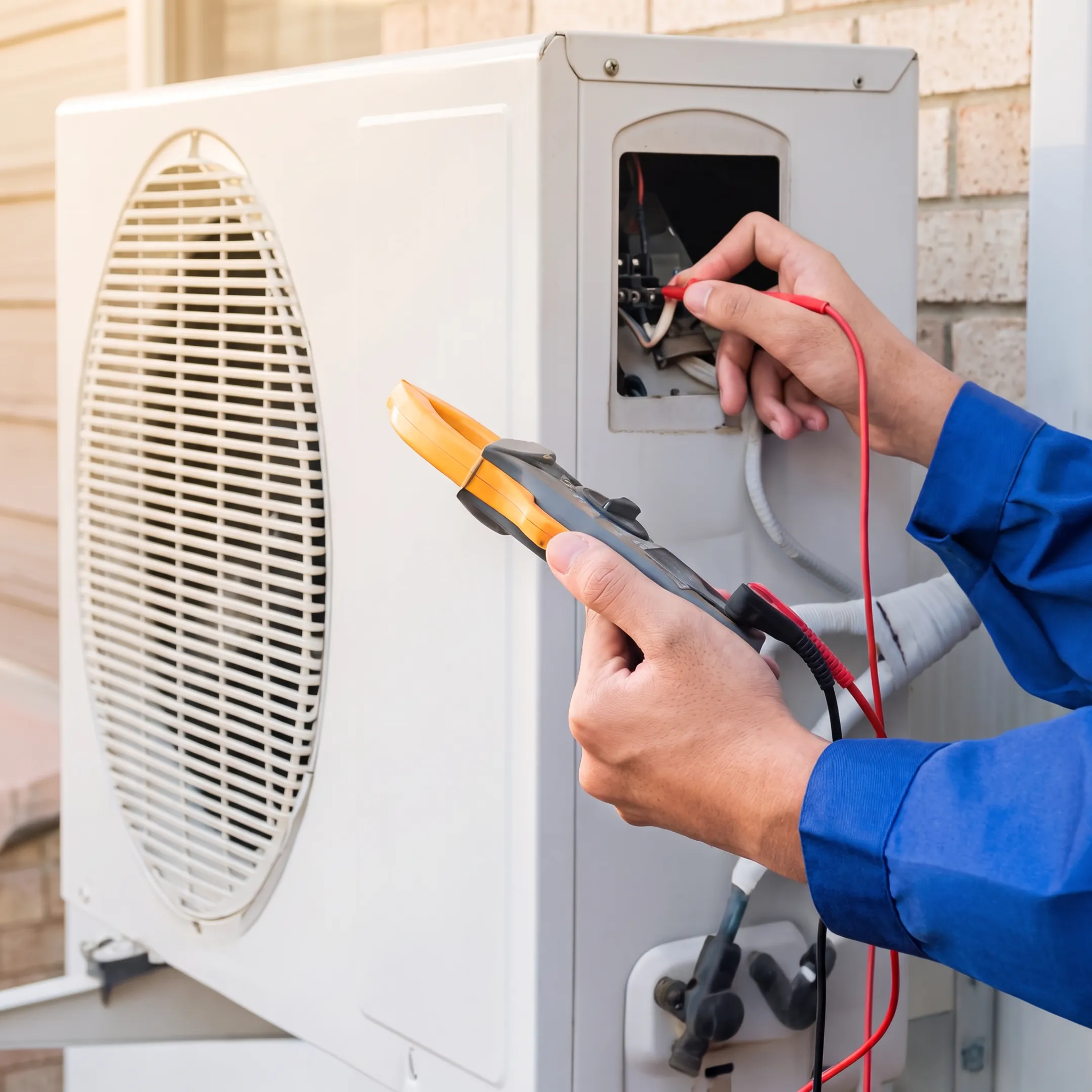 Technician repairing a residential air conditioning system in Texas