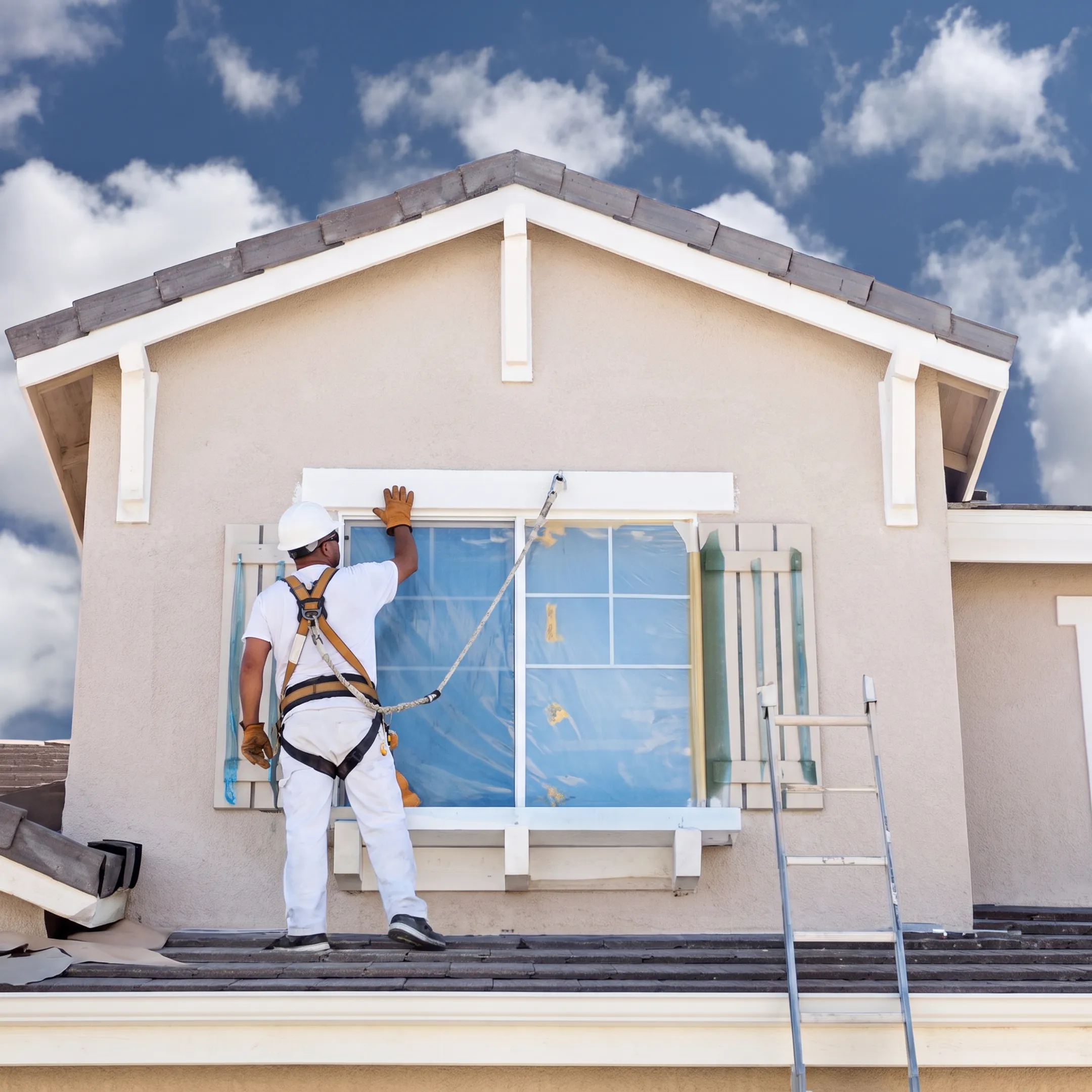 Professional replacing broken residential window glass