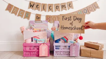 Joyful first day of homeschool photo setup with banner and sign