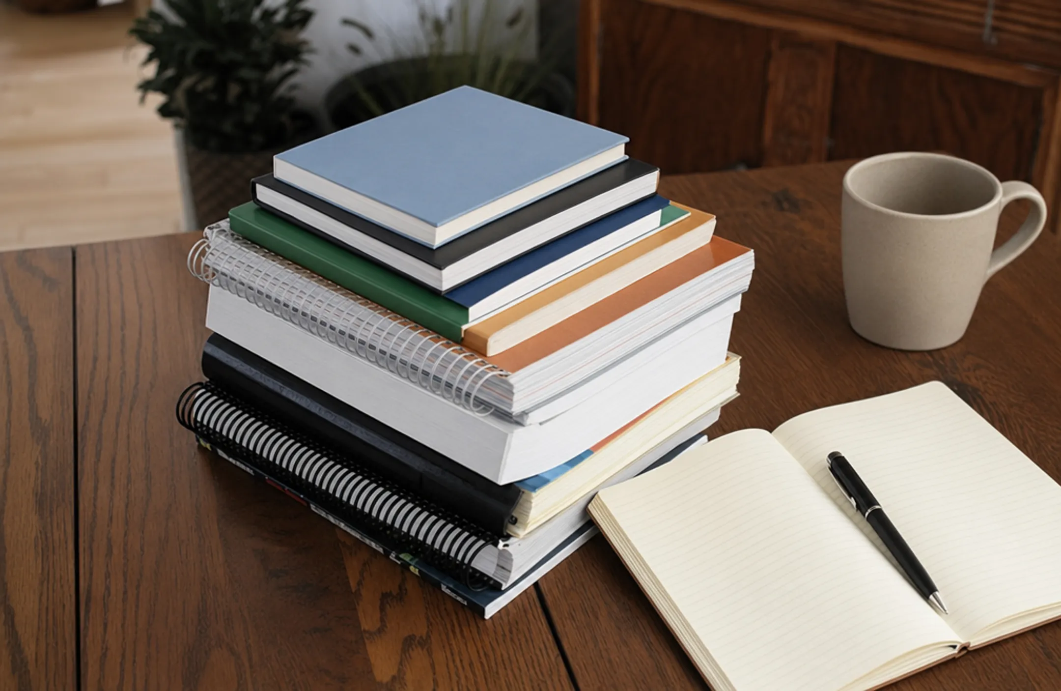 Stack of secular homeschool reference and philosophy books on desk