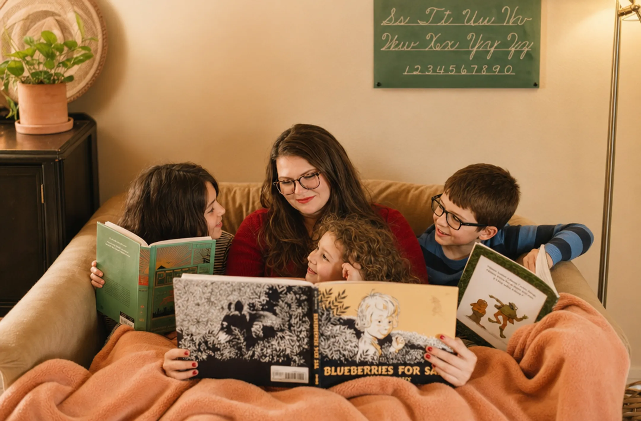 Multiple children reading living books together at home
