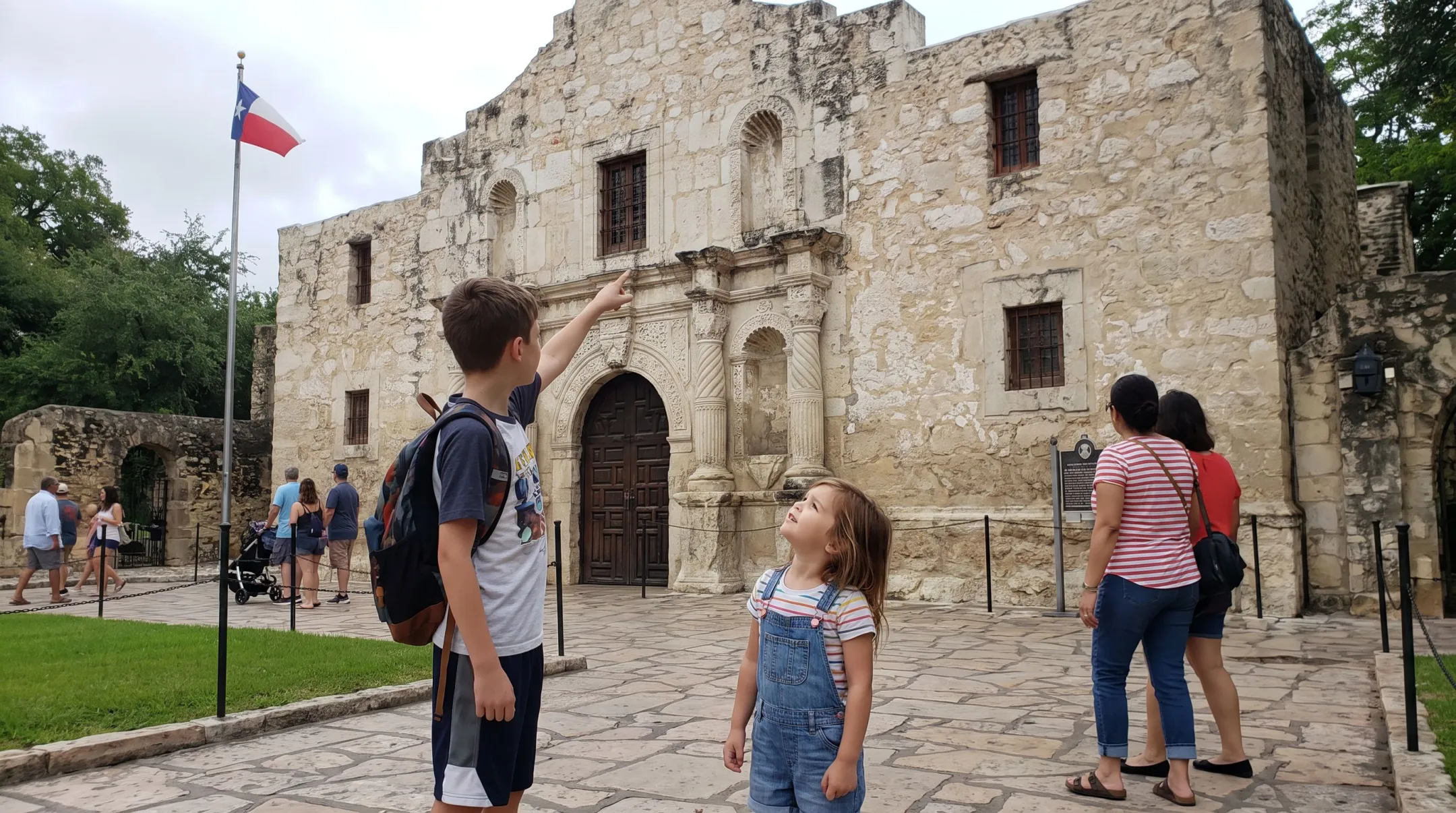 Multi-age homeschool siblings collaborating on Alamo history field trip