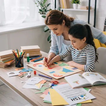 Parent and child creating art during homeschool