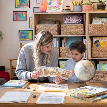 Kindergarten child learning history with a parent