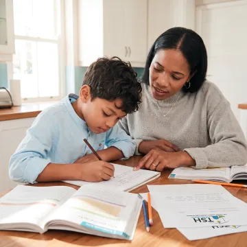 Parent and child working on a homeschool language arts lesson