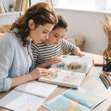 Parent and child studying ancient history at home