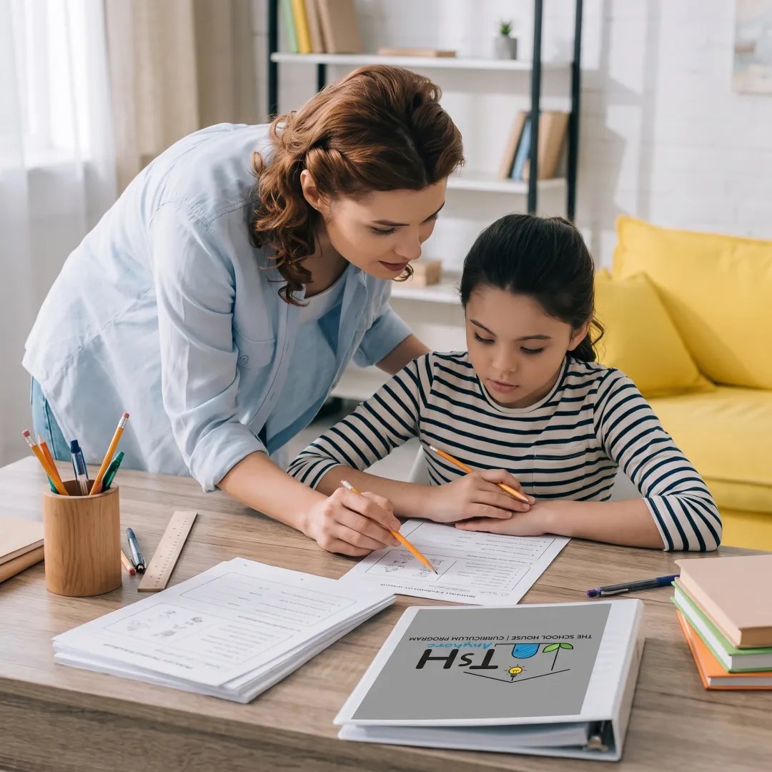 Homeschool parent guiding a child through a hands-on lesson