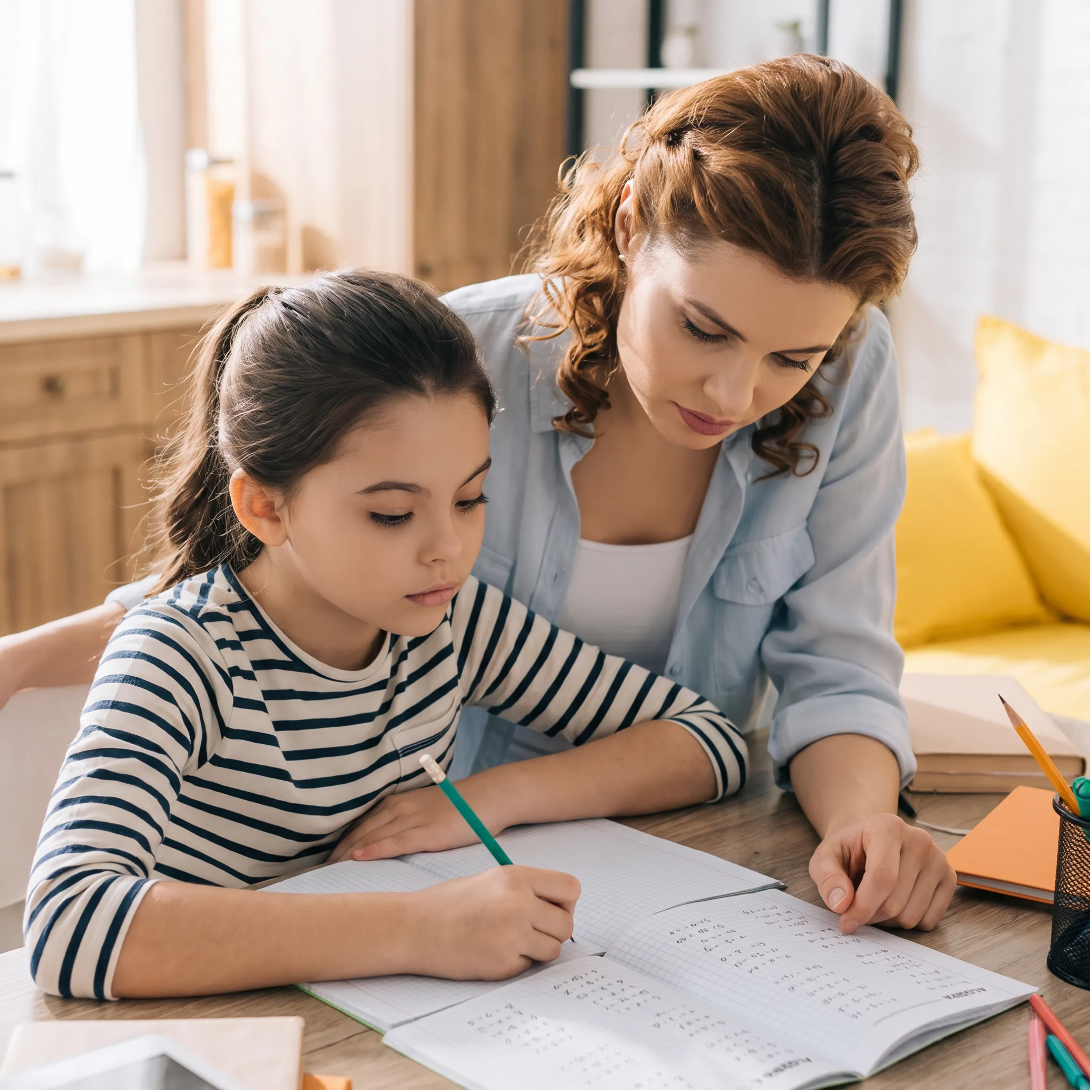 Parent and student working through an Algebra 1 lesson