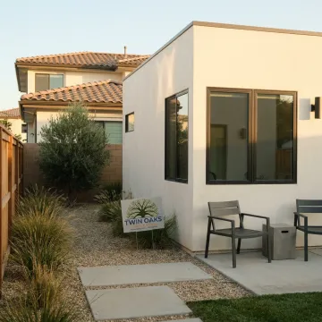 Modern backyard ADU beside a residential home