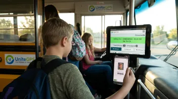 Student scanning ID barcode on tablet boarding school bus with Crosswalk platform