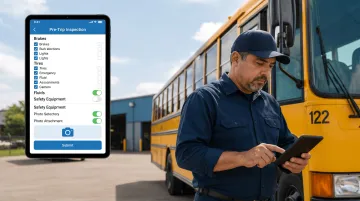 School bus driver completing digital pre-trip inspection checklist on tablet device with defect photo documentation