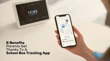 Parent using smartphone app to track child's school bus location