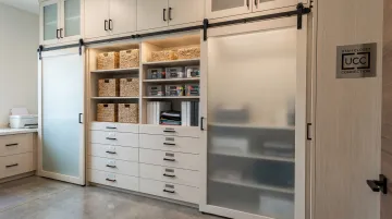 Custom built-in office storage cabinets with shelves drawers and organized supply zones