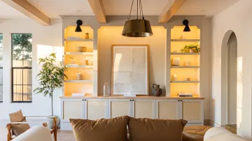 Living room built-in shelving combining open upper display shelves and closed lower cabinets