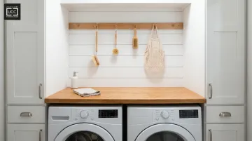 Farmhouse laundry closet interior with shiplap walls peg rail and wooden countertop