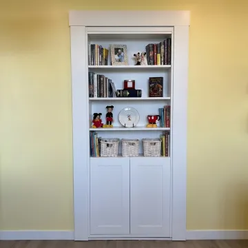 Custom hidden bookcase door in a home interior