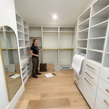 Designer reviewing custom wardrobe closet plans