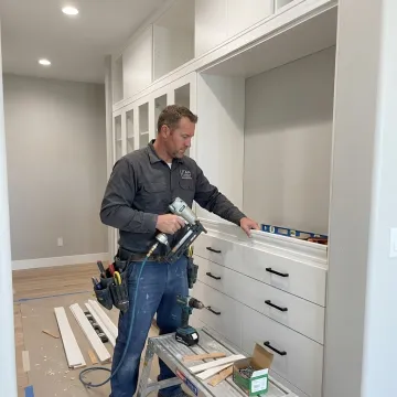 Cabinet installer fitting custom built-in storage